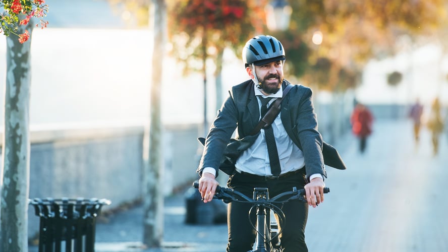 Corporate-and-social-man-on-bike-1140x810