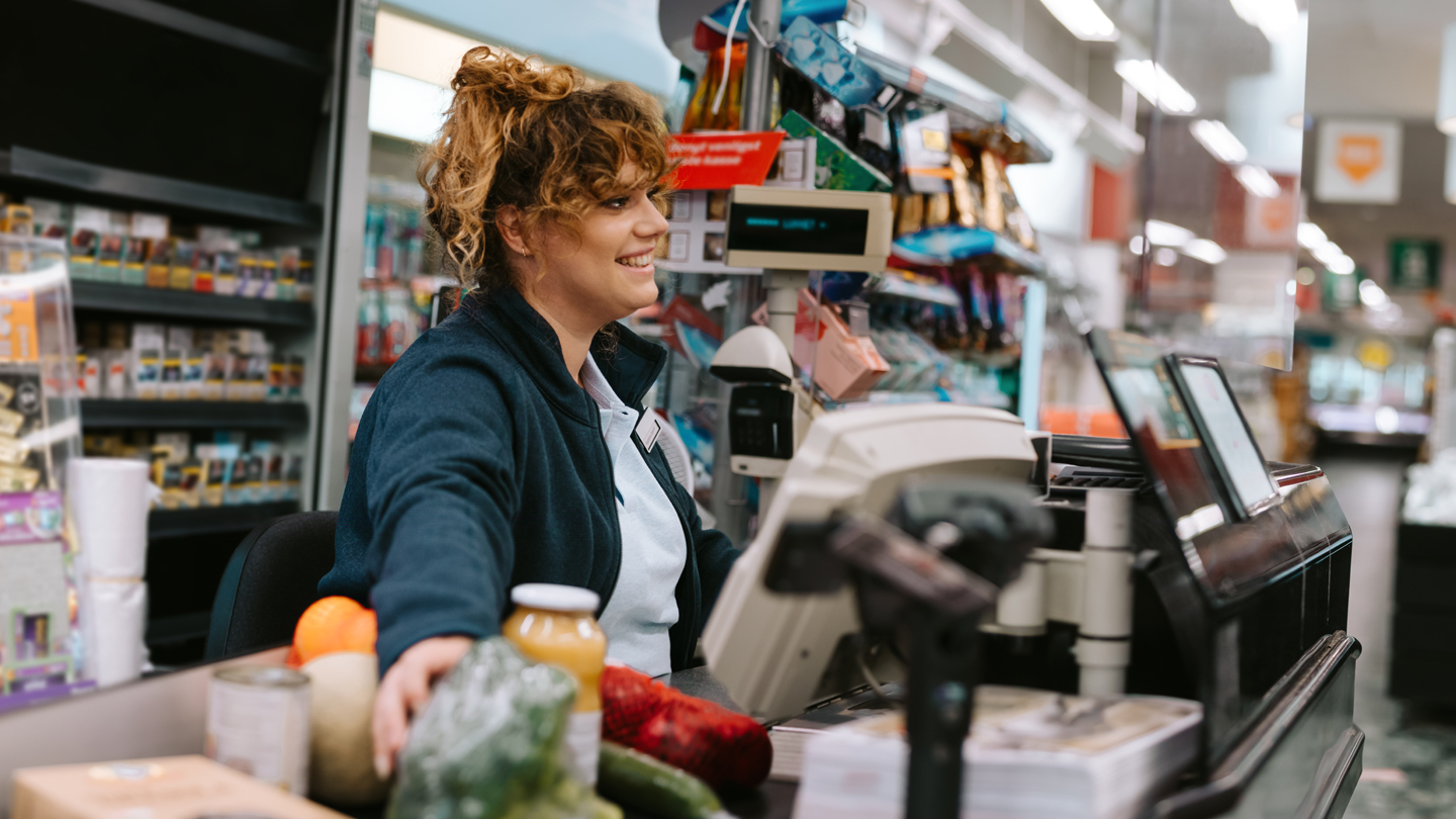 Retail-assisted-service,-lady-at-till-1140x810